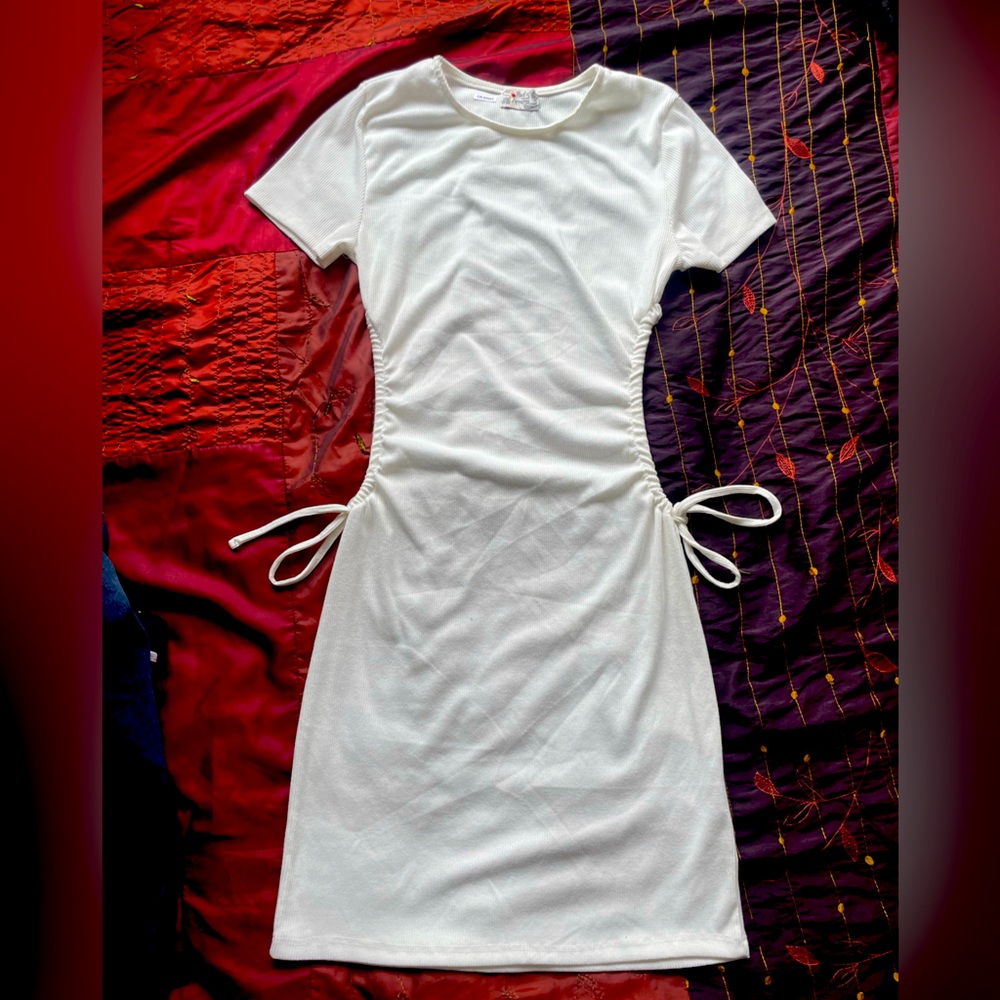 White dress with cutout drawstring adjustable sides (fits a medium to large)